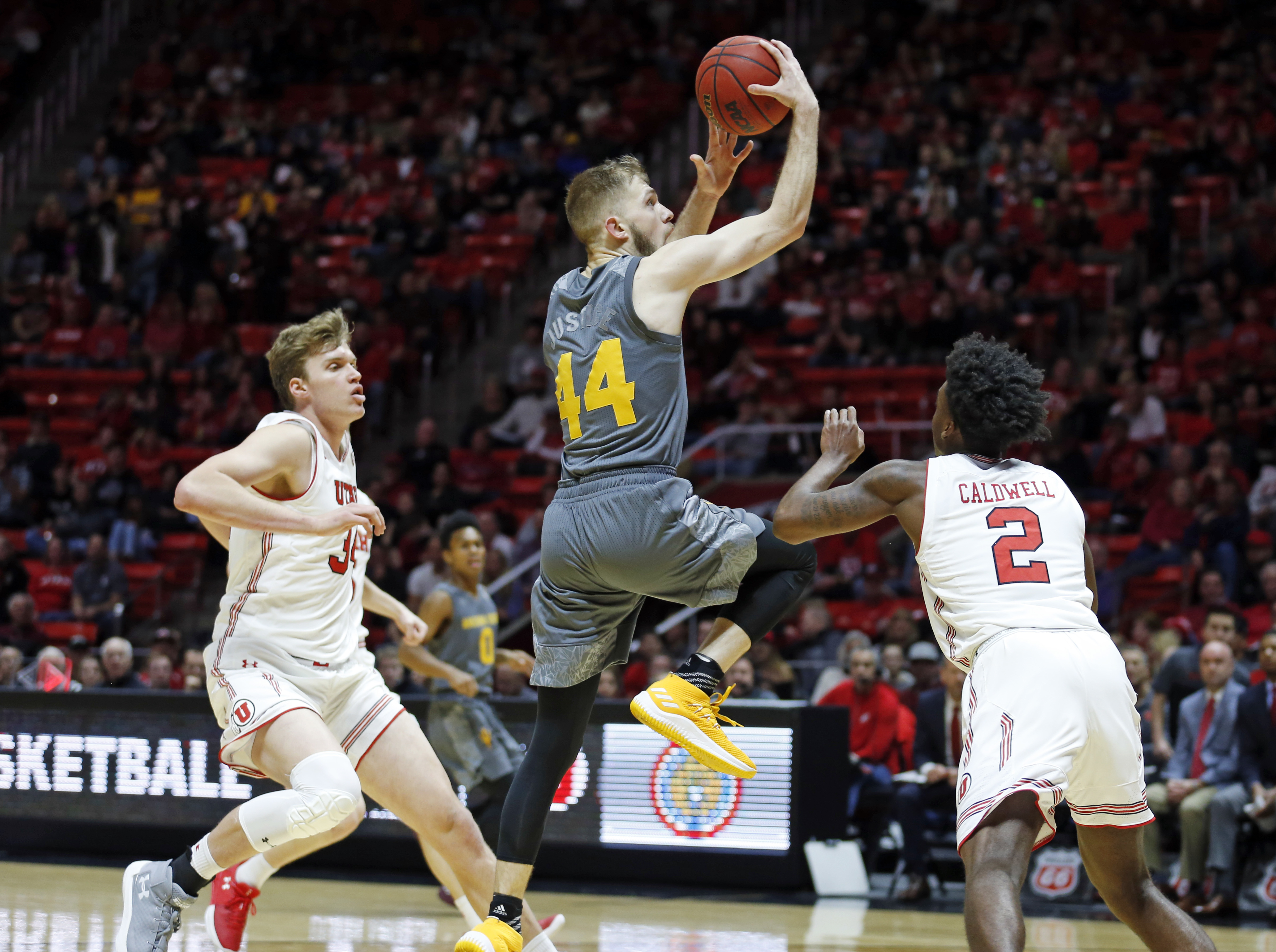 Arizona State guard Kodi Justice (44) goes to the basket as Utah's Jayce Johnson, left, and Kolbe Caldwell (2) defend in the first half of an NCAA college basketball game Sunday, Jan. 7, 2018, in Salt Lake City. (AP Photo, Rick Bowmer)
