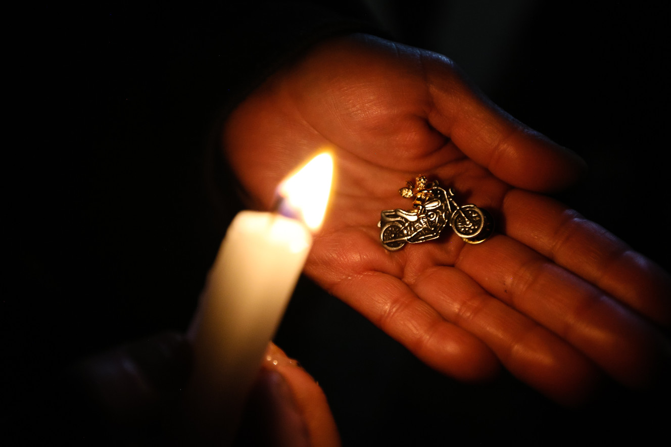 Dawn Nieto holds the pin given to her by Bikers Against Child Abuse during a vigil for her daughter, Vanessa, who was was killed in October 1988 as a result of child abuse, in Salt Lake City on Sunday, Jan. 7, 2018. (Photo: Adam Fondren, KSL)