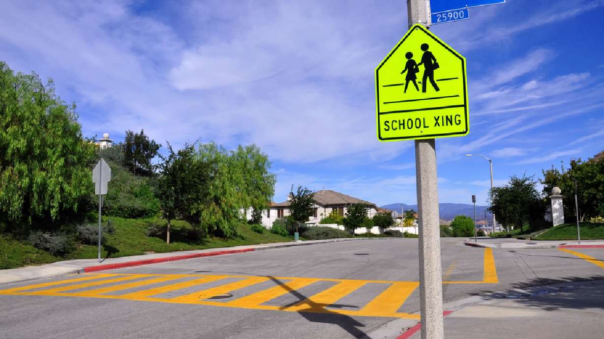 Make Your Week: Crossing guard gives away backpacks, bike helmets