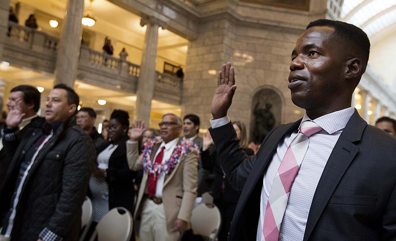 Hippolyte Kouadio, originally from the Ivory Coast, takes the oath of allegiance during a naturalization ceremony at the Capitol in Salt Lake City on Friday, Jan. 12, 2018. (Photo: Laura Seitz, KSL)