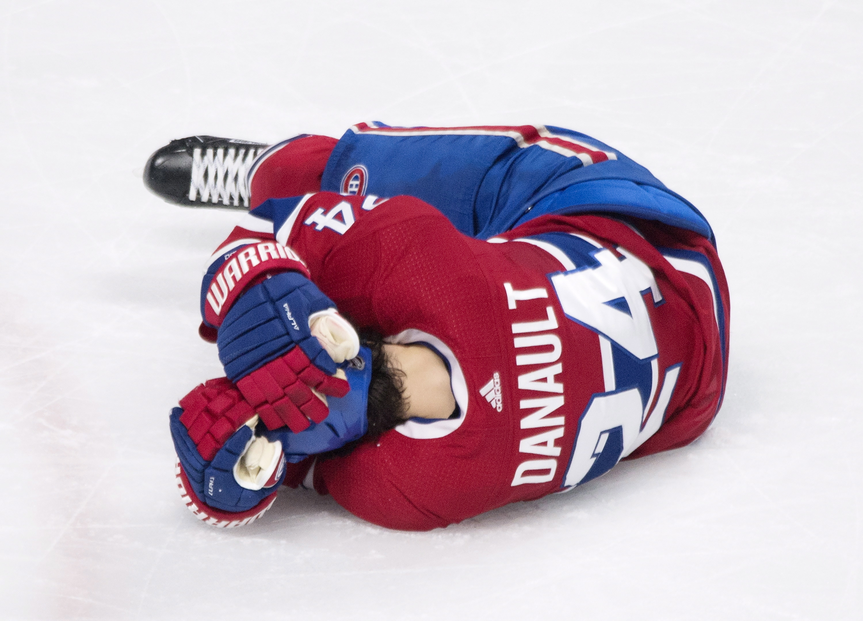 Canadiens F Danault hit in head by Chara slap shot