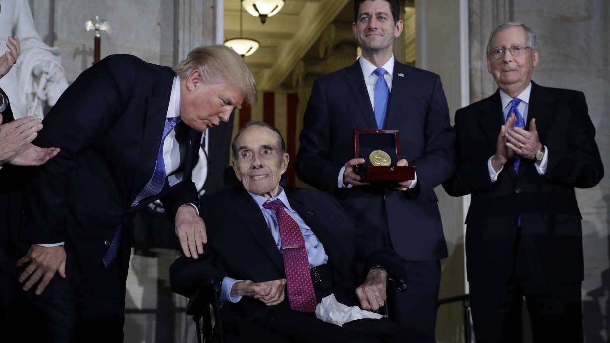 The Latest: Trump calls Bob Dole 'a true American hero'