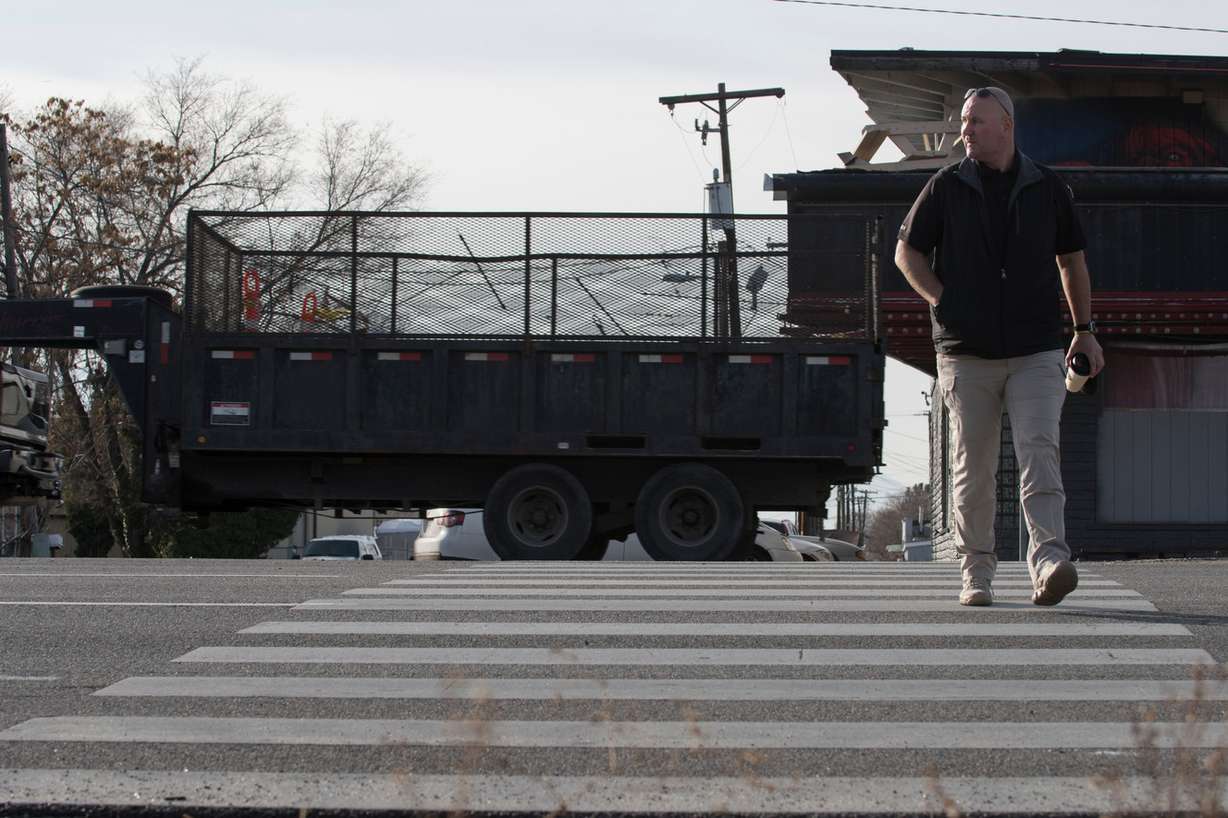South Salt Lake police officer Chad Keller crosses State Street at in the crosswalk at Gregson Avenue during a crosswalk traffic sting in on Wednesday, Jan. 17, 2018. Keller used the crosswalk at various times while other officers watched for vehicles that failed to yield to crossing pedestrians. South Salt Lake Sgt. Joe Cummings estimated that roughly 75 stops were made and 50 citations issued at the location during the operation's time frame of about 1 p.m. to 3:30 p.m. South Salt Lake police spokesman Gary Keller said the operation was conducted in response to a citizen complaint. (Photo: Jacob Wiegand, KSL)