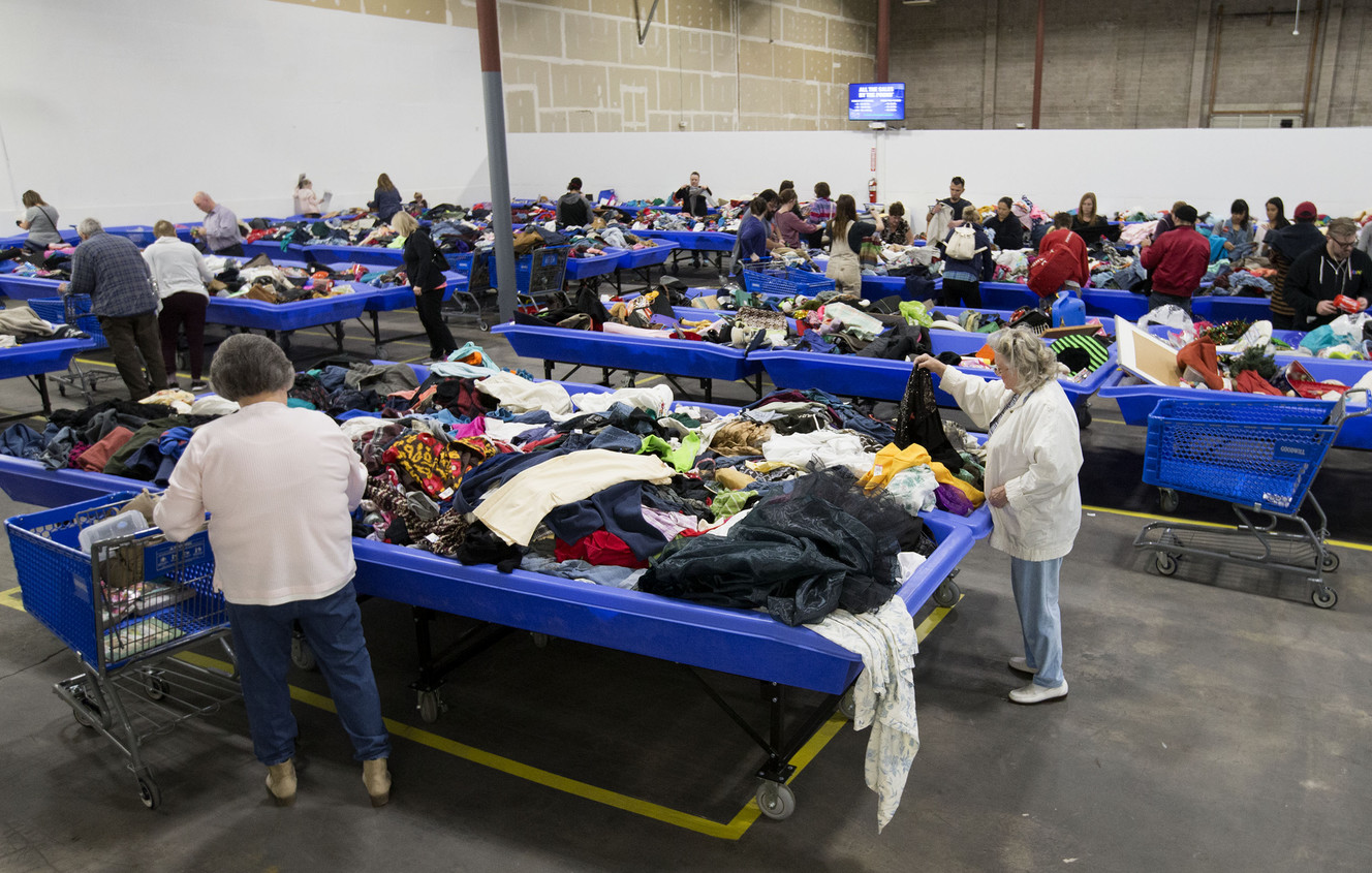 Patrons shop at the Goodwill outlet store at 1850 W. 1500 South in Salt Lake City on Thursday, Jan. 18, 2018. According to Jason Asher, director of retail product and logistics, a Goodwill outlet store operates very differently from a traditional Goodwill store. “In an outlet, clothing and other items for sale are placed in large bins and arranged in a large ‘warehouse-like’ area. New bins of merchandise are then rotated onto the sale floor throughout the day,” said Asher. “Rather than purchasing individual items, customers buy a majority of items in the outlet by the pound,” he added. The Goodwill Outlet’s prices will start at $.39 per pound for books and $1.59 per pound for clothing and other items with discounted pricing with larger purchases. (Photo: Laura Seitz, Deseret News)
