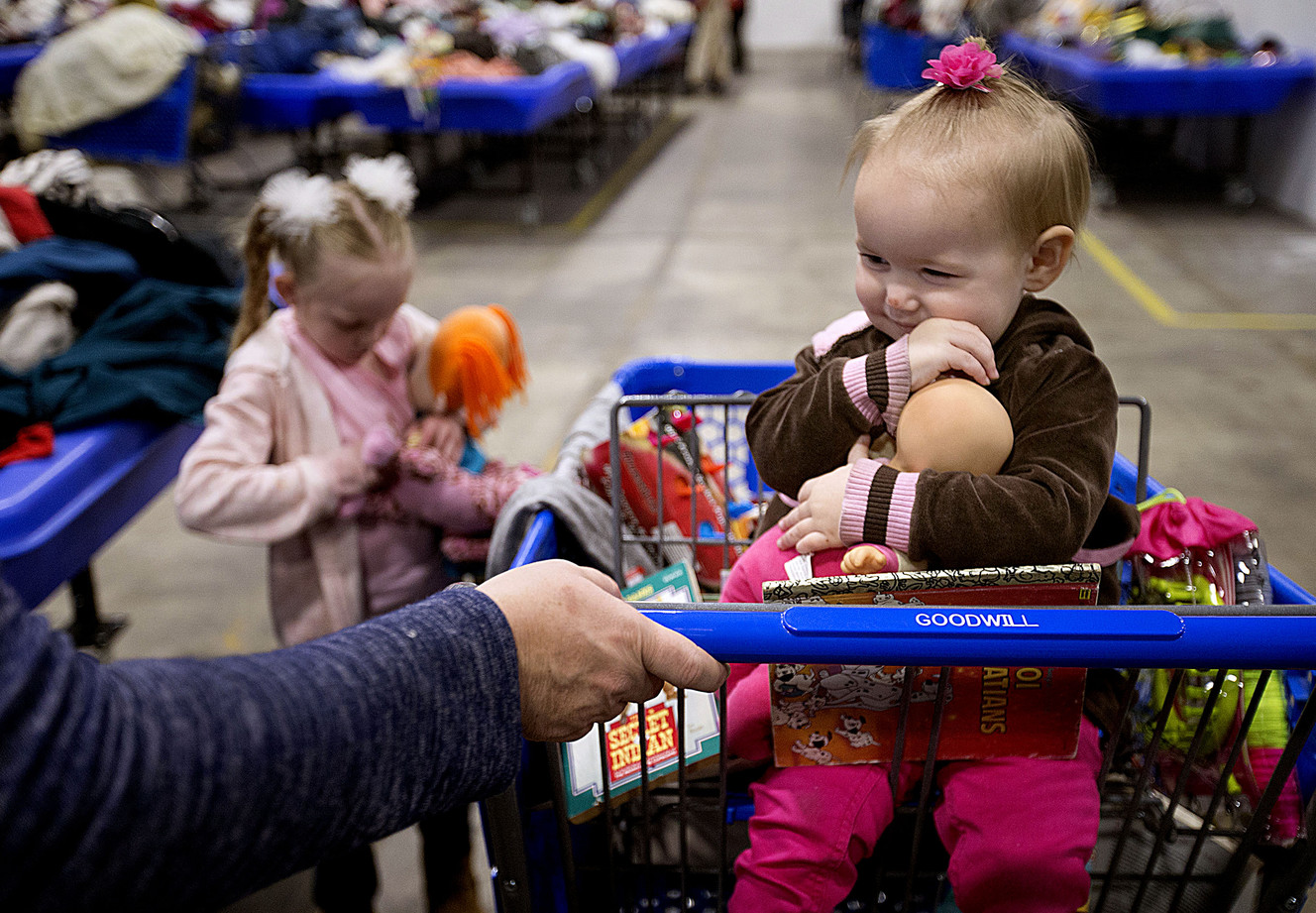Olivia Overman, 18-months, of Tooele, hugs a doll that she chose while shopping with her mother and sister Lacy at the Goodwill outlet store at 1850 W. 1500 South in Salt Lake City on Thursday, Jan. 18, 2018. (Photo: Laura Seitz, KSL)