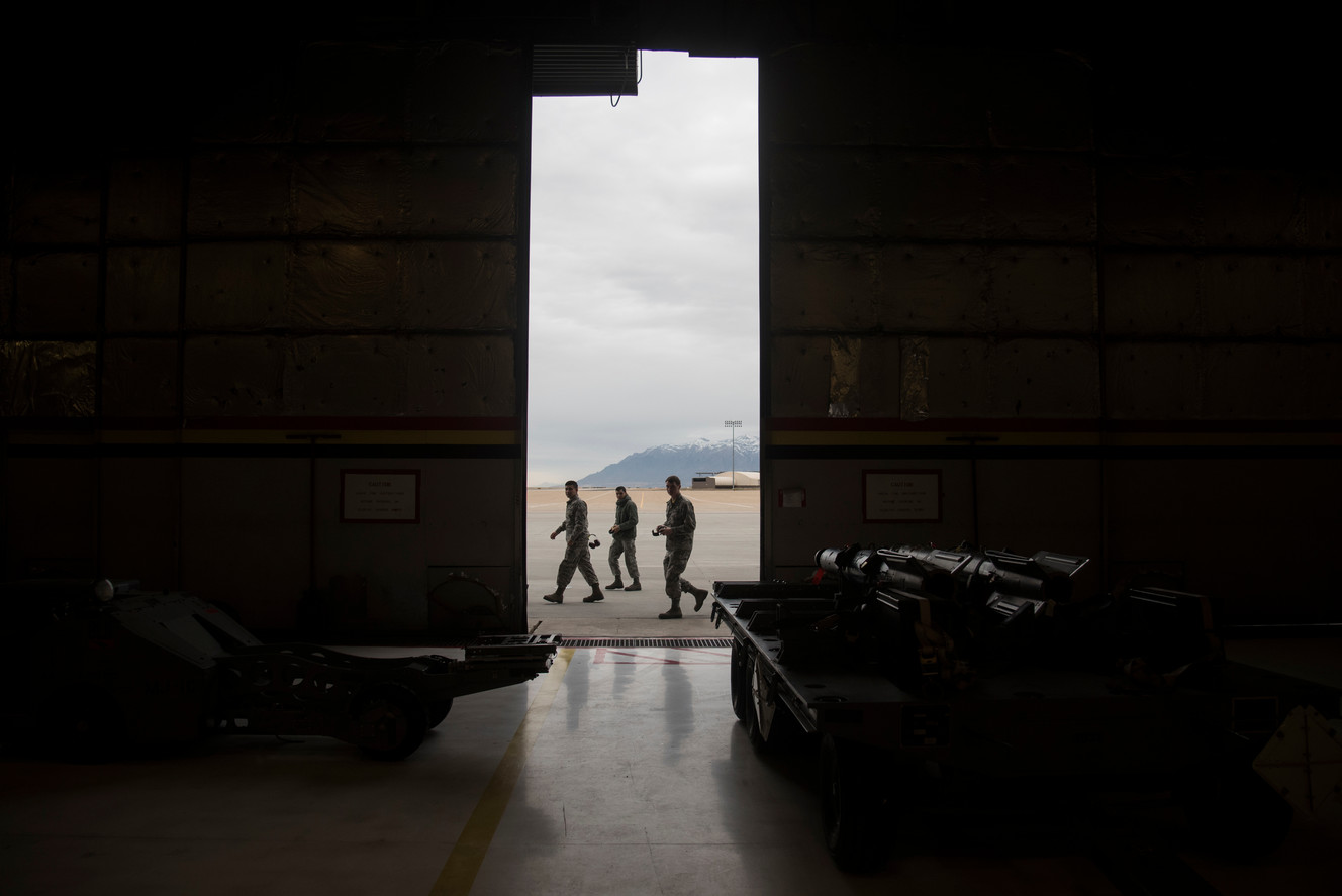 Military personnel pass by an open hangar door before the start of an F-35A weapons loading competition at Hill Air Force Base on Friday, Jan. 19, 2018. (Photo: Jacob Wiegand, KSL)