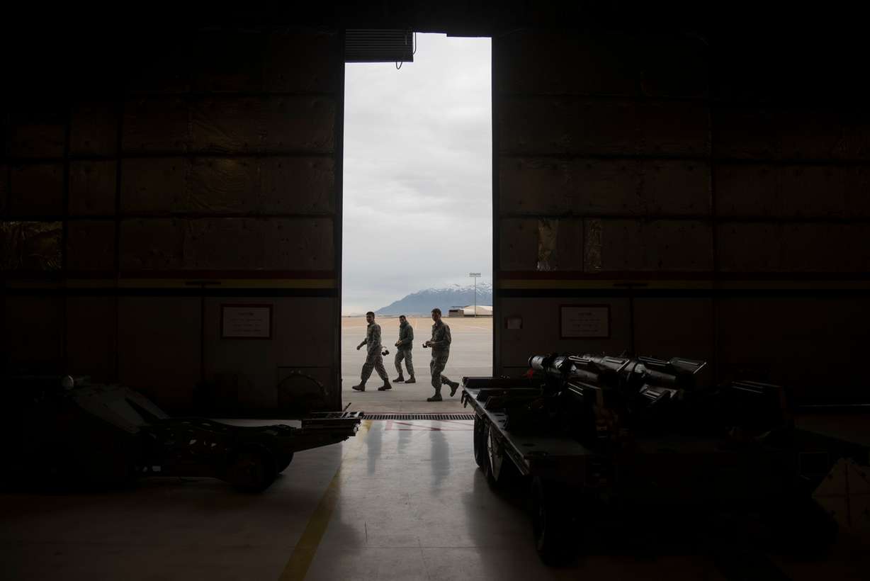 Military personnel pass by an open hangar door before the start of an F-35A weapons loading competition at Hill Air Force Base on Friday, Jan. 19, 2018. (Photo: Jacob Wiegand, KSL)