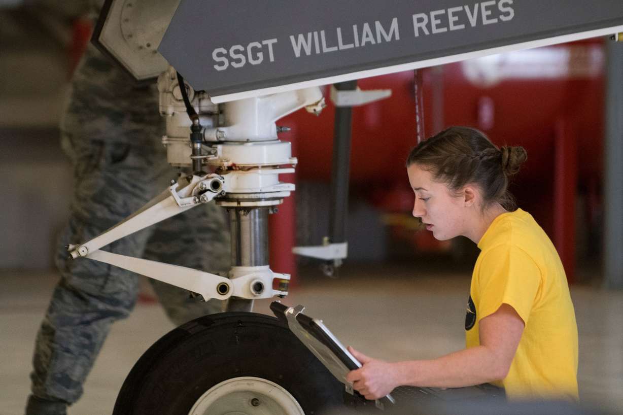 Staff Sgt. Kayla Bruns, of Taylorville, Ill., works with the other two members of her crew to load a GBU-12 bomb during a F-35A weapons loading competition at the Hill Air Force Base on Friday, Jan. 19, 2018. (Photo: Jacob Wiegand, KSL)