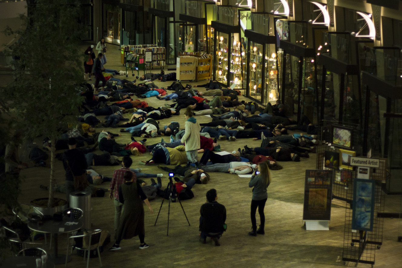 Participants pretend to be dead to represent the many deaths associated with Utah's poor air quality during a "die-in" at the Salt Lake City Main Library on Wednesday, Jan. 17, 2018. (Photo: Carter Williams, KSL.com)