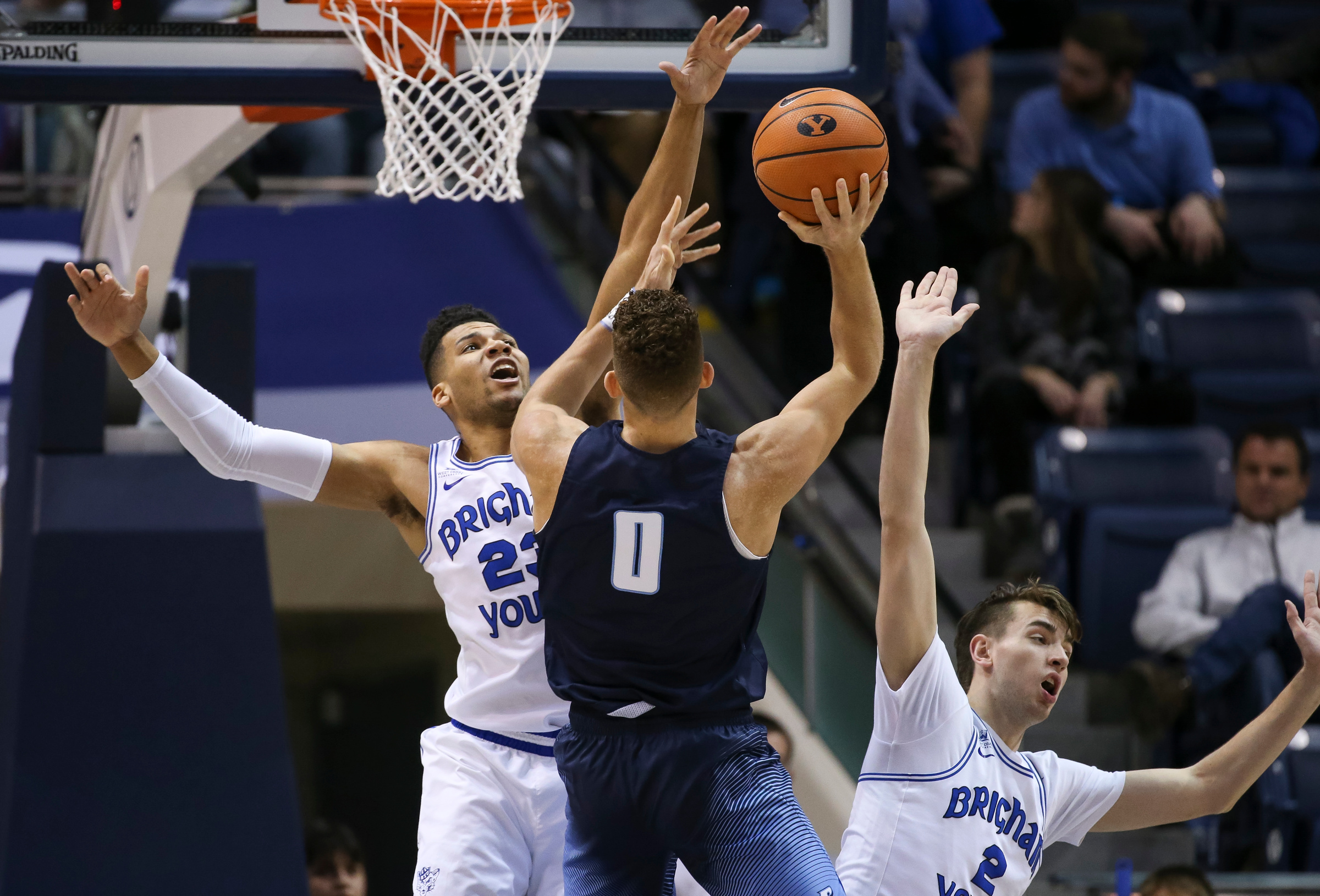 San Diego forward Isaiah Pineiro (0) shoots against Brigham Young forward Yoeli Childs (23) and guard Zac Seljaas (2) at the Marriott Center in Provo on Saturday, Jan. 20, 2018. (Photo: Spenser Heaps, Deseret News)