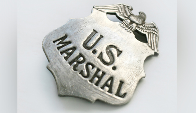 Man knocked on doors impersonating a federal agent, police say