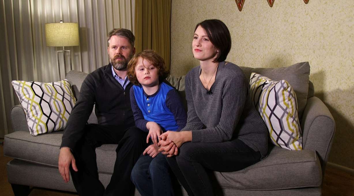 Dr. Jeffrey Bigelow, a neurologist, sits next to his 7-year-old son, Henri, and his wife, Alexis Bigelow, in their Millcreek home Wednesday, Dec. 13, 2017. Henri has a severe form of muscular dystrophy, a genetic disorder. His parents are hopeful that scientists can use CRISPR technology to edit the DNA of someone with a genetic disorder. (Photo: Alan Luchetti, KSL)