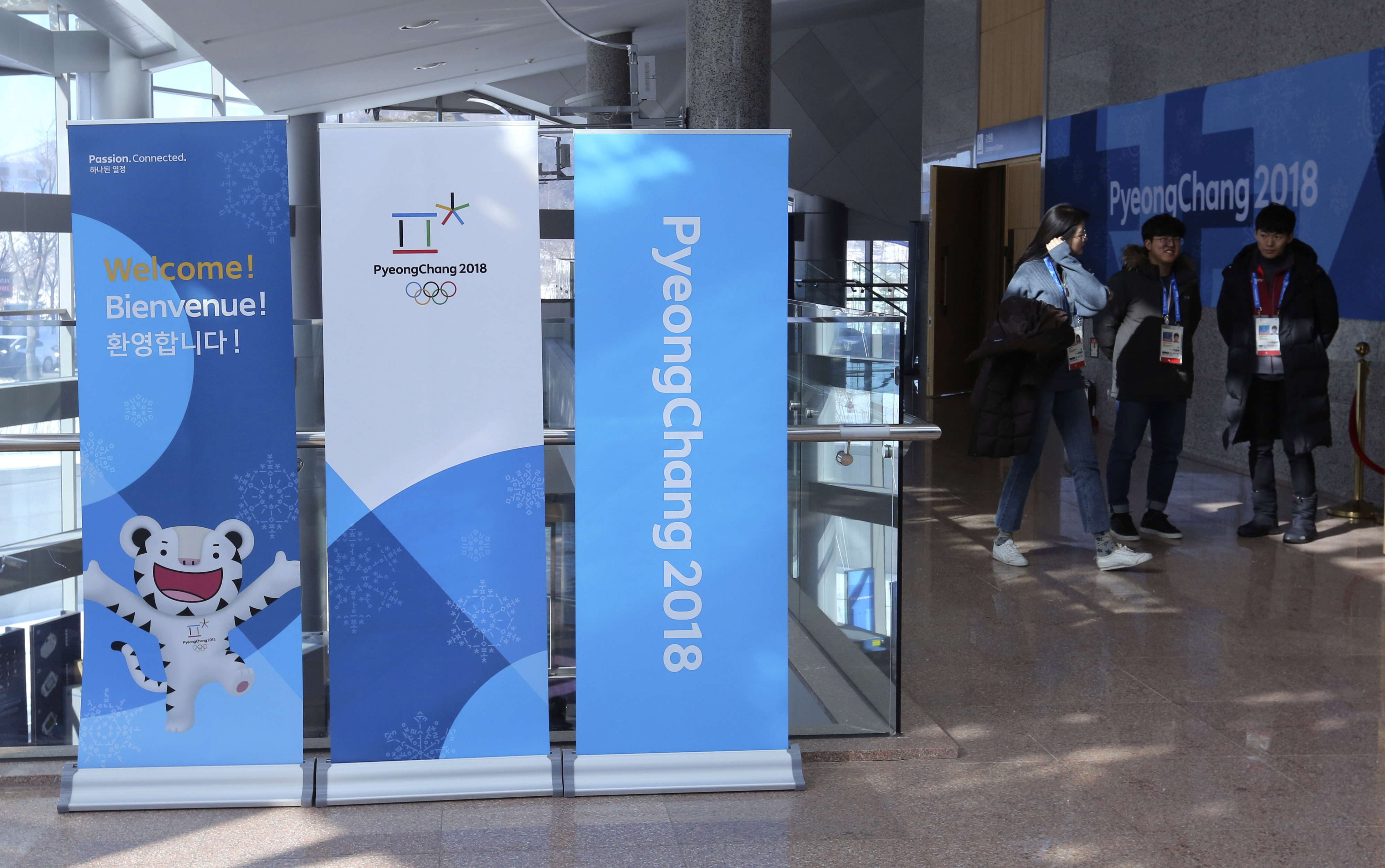 Activists rip Kim Jong Un's photo in Olympic protest