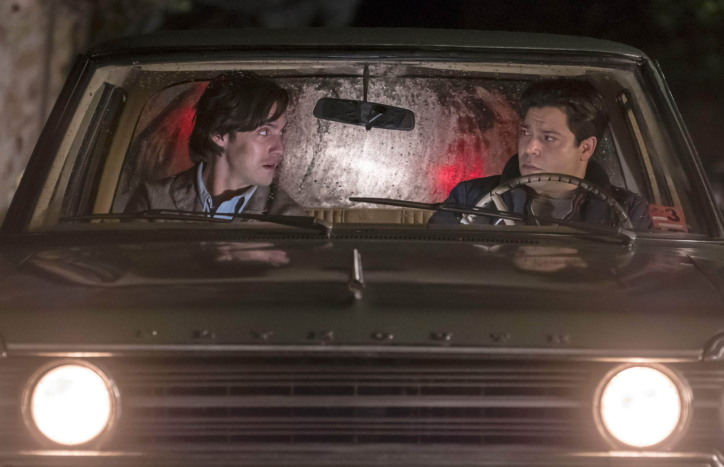 In this image released by NBC, Milo Ventimiglia, left, and Jeremy Luke appear in a scene from "This is Us." The heartwarming NBC series was second only to CBS' "NCIS" for the most popular show of the week for its debut season finale last week. The show reached 12.8 million viewers on the night it first aired, with the audience swelling to 16.9 million when people who watched via time delay over three days is added in, the Nielsen company said. (Ron Batzdorff/NBC via AP)