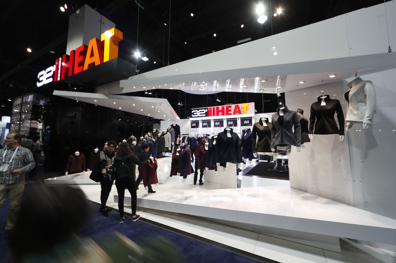 Retailers look at the display of clothing at the opening of the Outdoor Retailers and Snow Show in the Colorado Convention Center, Thursday, Jan. 25, 2018, in Denver. Three floors of all the latest products for outdoor use makes the event the largest U.S. trade show for the outdoor and winter sports industries that represent $887 billion in sales. (AP Photo/David Zalubowski)