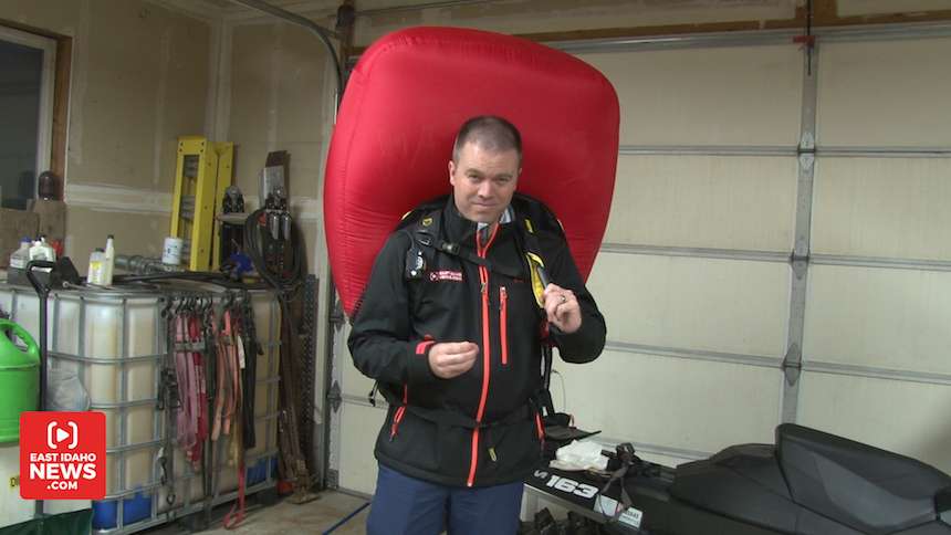 EastIdahoNews.com reporter Nate Eaton demonstrates how an avalanche airbag works. The bags provide extra space for a buried victim and are designed to make the person wearing it larger so they naturally rise to the surface of the snow. (Photo: EastIdahoNews.com)