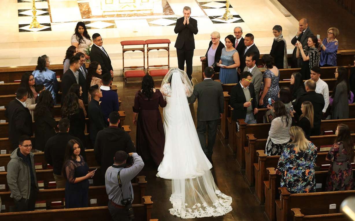 Gabriele Terrone reacts to seeing his bride Noemí Pulido prior to their wedding at the Cathedral of the Madeleine in Salt Lake City on Saturday, Jan. 27, 2018. Andrew Unsworth, an organist at the LDS Tabernacle, played the organ for the wedding of his friend and successor. Terrone, the cathedral's organist, is a former organist at Santa Maria Maggiore, one of the four major churches in Rome. (Photo: Jeffrey D. Allred, KSL)