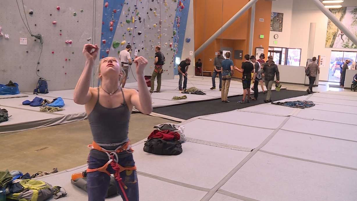 Sami Singleton moves her arms to chart her course up the wall at Momentum Indoor Climbing in Millcreek on January 23rd, 2018. (Photo: Ray Boone, KSL TV)