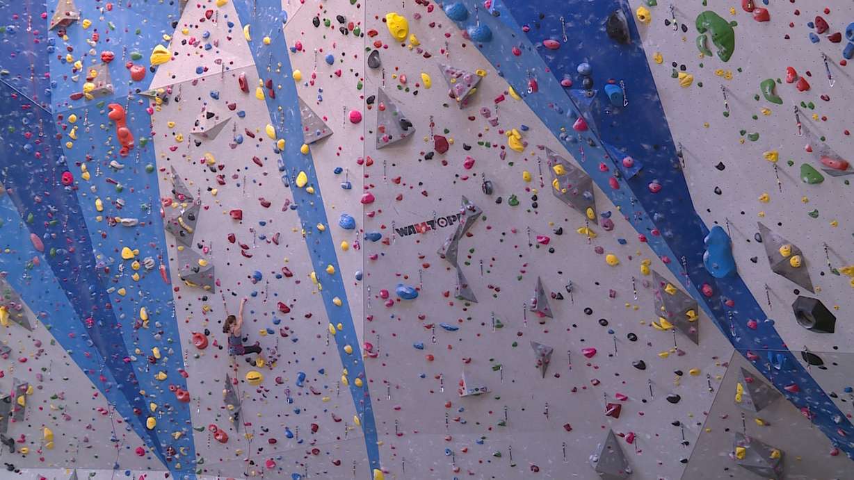 A woman climbs the wall at Momentum Indoor Climbing in Millcreek on January 23rd, 2018. (Photo: Ray Boone, KSL TV)