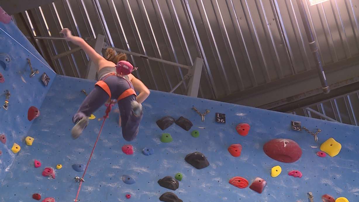 Sami Singleton jumps from the top of the wall at Momentum Indoor Climbing in Millcreek on January 23rd, 2018. (Photo: Ray Boone, KSL TV)