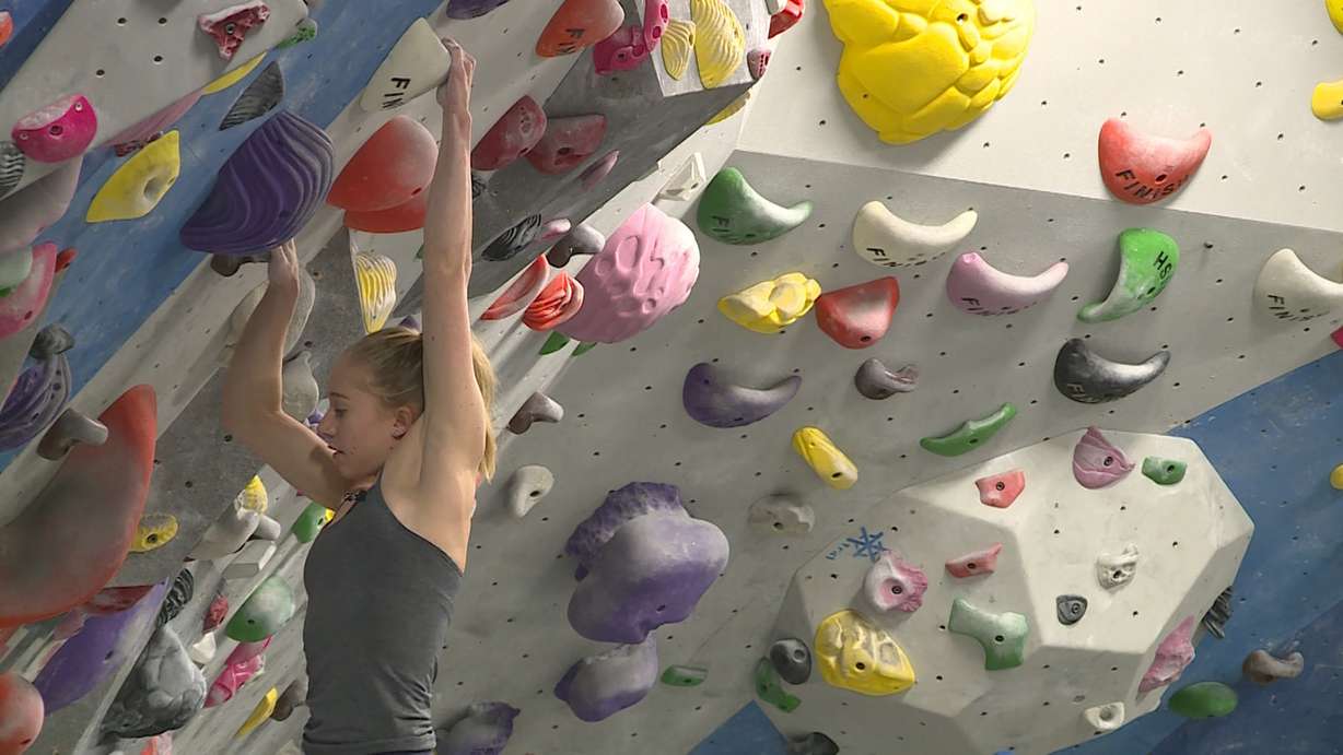 Sami Singleton lowers herself down the wall at Momentum Indoor Climbing in Millcreek on January 23rd, 2018. (Photo: Ray Boone, KSL TV)