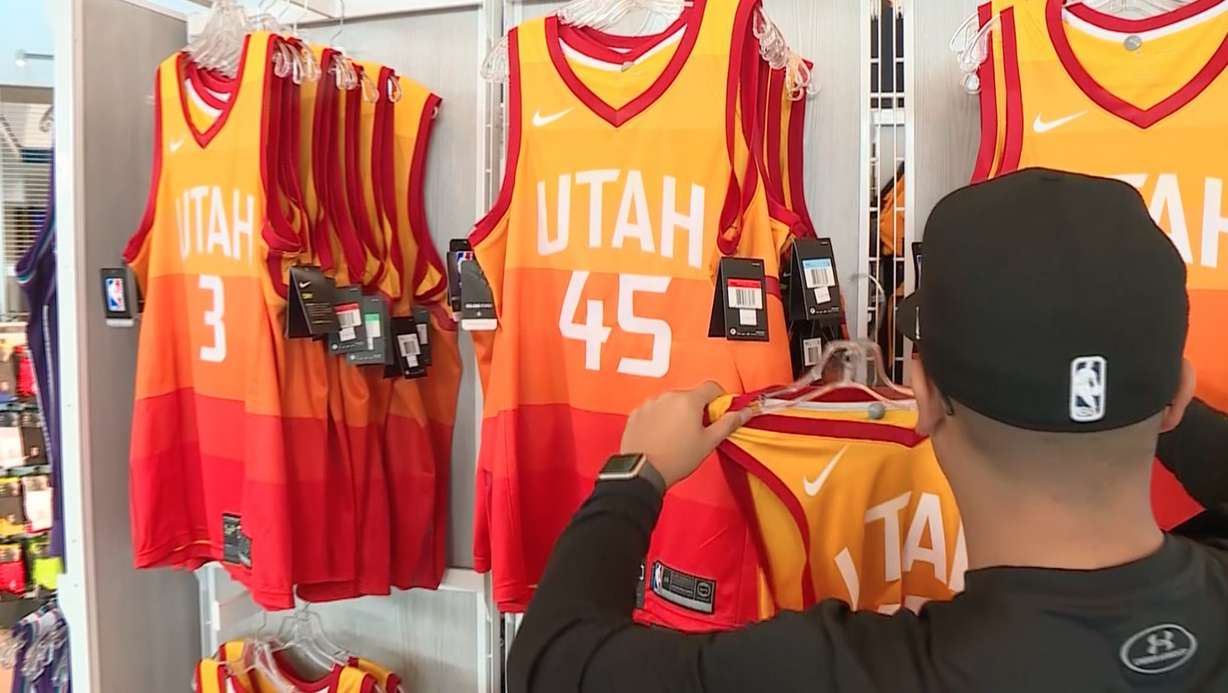 A Utah Jazz Store employee puts a Jazz "City Edition" jersey on a rack on Tuesday, Jan. 23, 2018. (Photo: John Wilson, KSL TV)