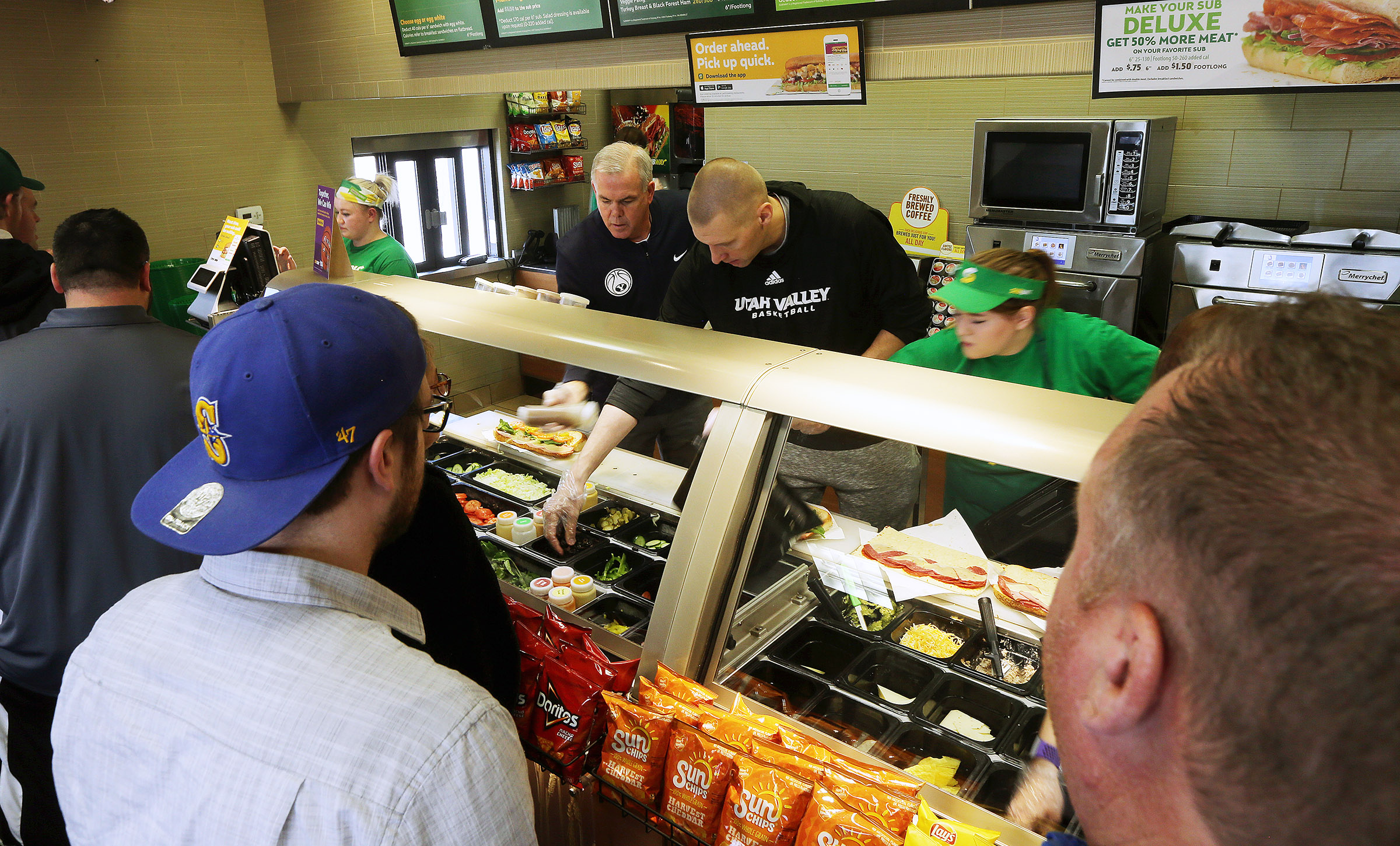 BYU's and UVU's head basketball coaches Dave Rose and Mark Pope team up to make sandwiches for customers at a Subway in Orem to show support for Coaches vs. Cancer on Tuesday, Jan. 30, 2018. (Photo: Scott G Winterton, KSL)