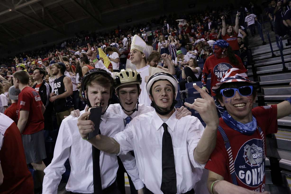 Fans in the Gonzaga student section pose for a photograph before an NCAA college basketball game against BYU in Spokane, Wash., Saturday, Feb. 25, 2017. (AP Photo, Young Kwak)
