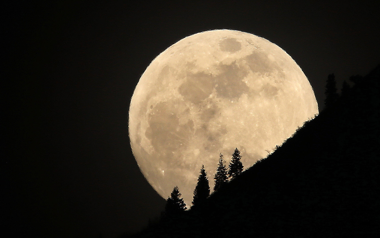 The supermoon rises over Grandeur Peak in Salt Lake City on Tuesday, Jan. 30, 2018. A supermoon occurs at its perigee, the point in the moon's orbit when it is nearest to the Earth, making the moon appear larger and brighter than normal. (Photo: Jeffrey D. Allred, KSL)