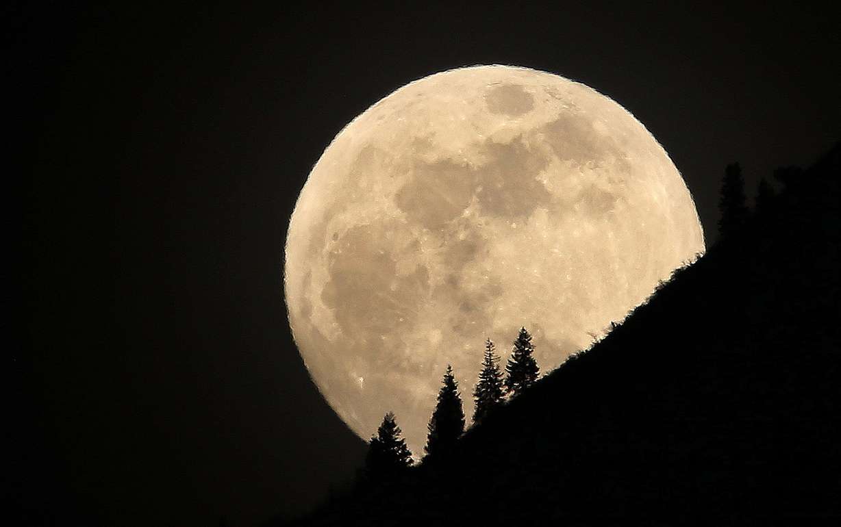 The supermoon rises over Grandeur Peak in Salt Lake City on Tuesday, Jan. 30, 2018. A supermoon occurs at its perigee, the point in the moon's orbit when it is nearest to the Earth, making the moon appear larger and brighter than normal. (Photo: Jeffrey D. Allred, KSL)