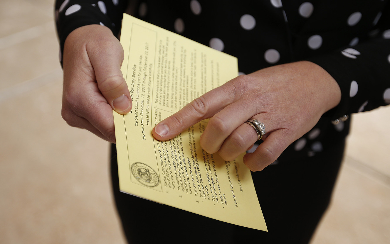 Christy Froehlich shows her jury summons on Thursday, Feb. 1, 2018. Froehlich met with 3rd District Judge Kent Holmberg in Summit County to show cause for not showing up for jury duty on Dec. 12, 2017. On that day, 36 people did not show up for jury duty, forcing the judge to declare a mistrial in the case of three men accuse of gang-raping a 9-year-old girl because the potential jury pool was too small. (Photo: Jeffrey D. Allred, KSL)