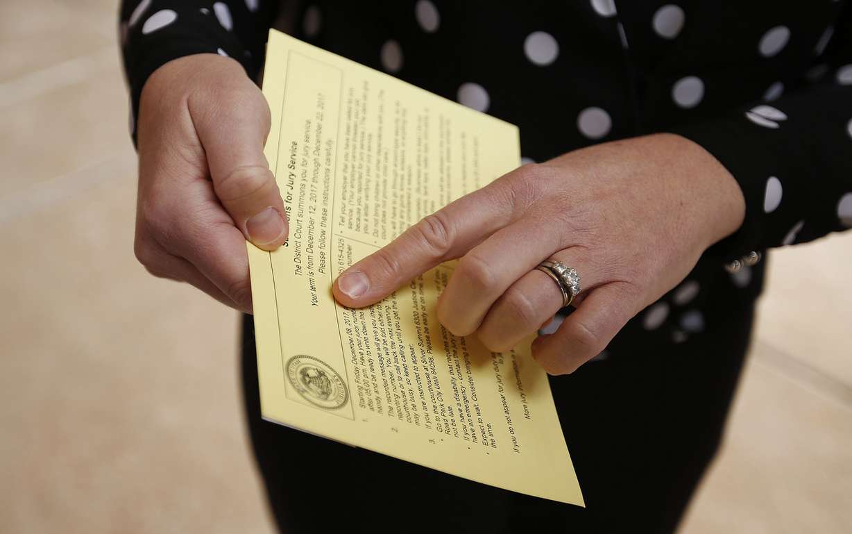 Christy Froehlich shows her jury summons on Thursday, Feb. 1, 2018. Froehlich met with 3rd District Judge Kent Holmberg in Summit County to show cause for not showing up for jury duty on Dec. 12, 2017. On that day, 36 people did not show up for jury duty, forcing the judge to declare a mistrial in the case of three men accuse of gang-raping a 9-year-old girl because the potential jury pool was too small. (Photo: Jeffrey D. Allred, KSL)