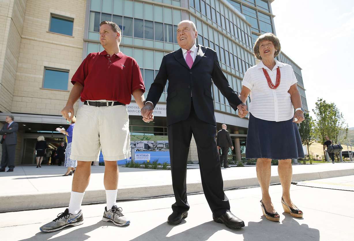 Jon Huntsman Sr., center, is escorted by his son, left, and wife, Karen, right, to the grand opening festivities for the Primary Children’s and Families’ Cancer Research Center at Huntsman Cancer Institute in Salt Lake City on Wednesday, June 21, 2017. The new facility is dedicated to the study of genetically traced cancers known to afflict children. (Photo: Jeffrey D. Allred, KSL)