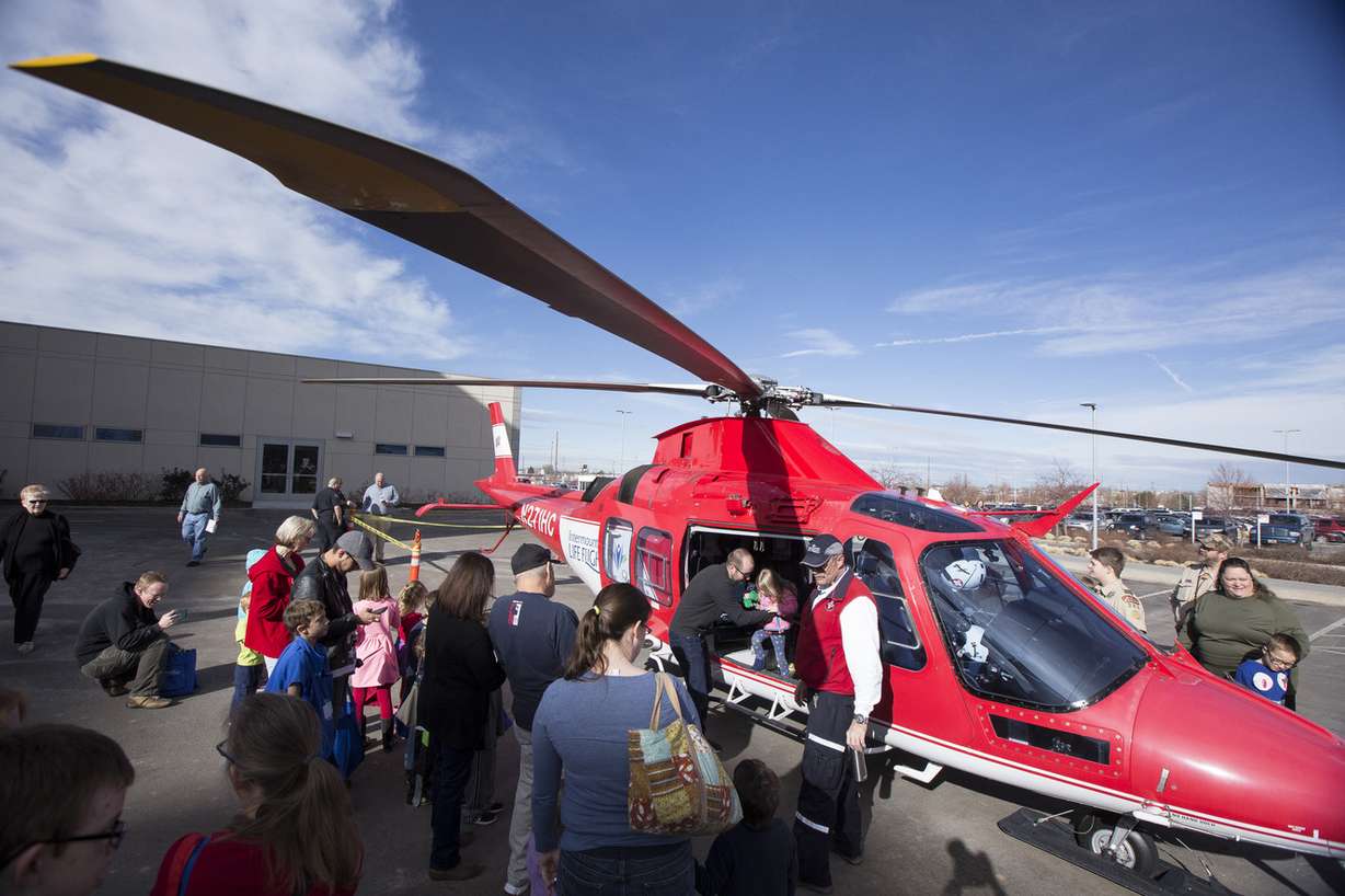 Spectators tour an Intermountain Life Flight helicopter during Heartbeat 2018, Intermountain Healthcare's Community Heart Fair in Murray on Saturday, Feb. 3, 2018. The event offered spectators a chance to learn about heart health, as well as take part in activities such as touring the inflatable heart, examining emergency vehicles and meeting with therapy animals. (Photo: Jacob Wiegand, KSL)