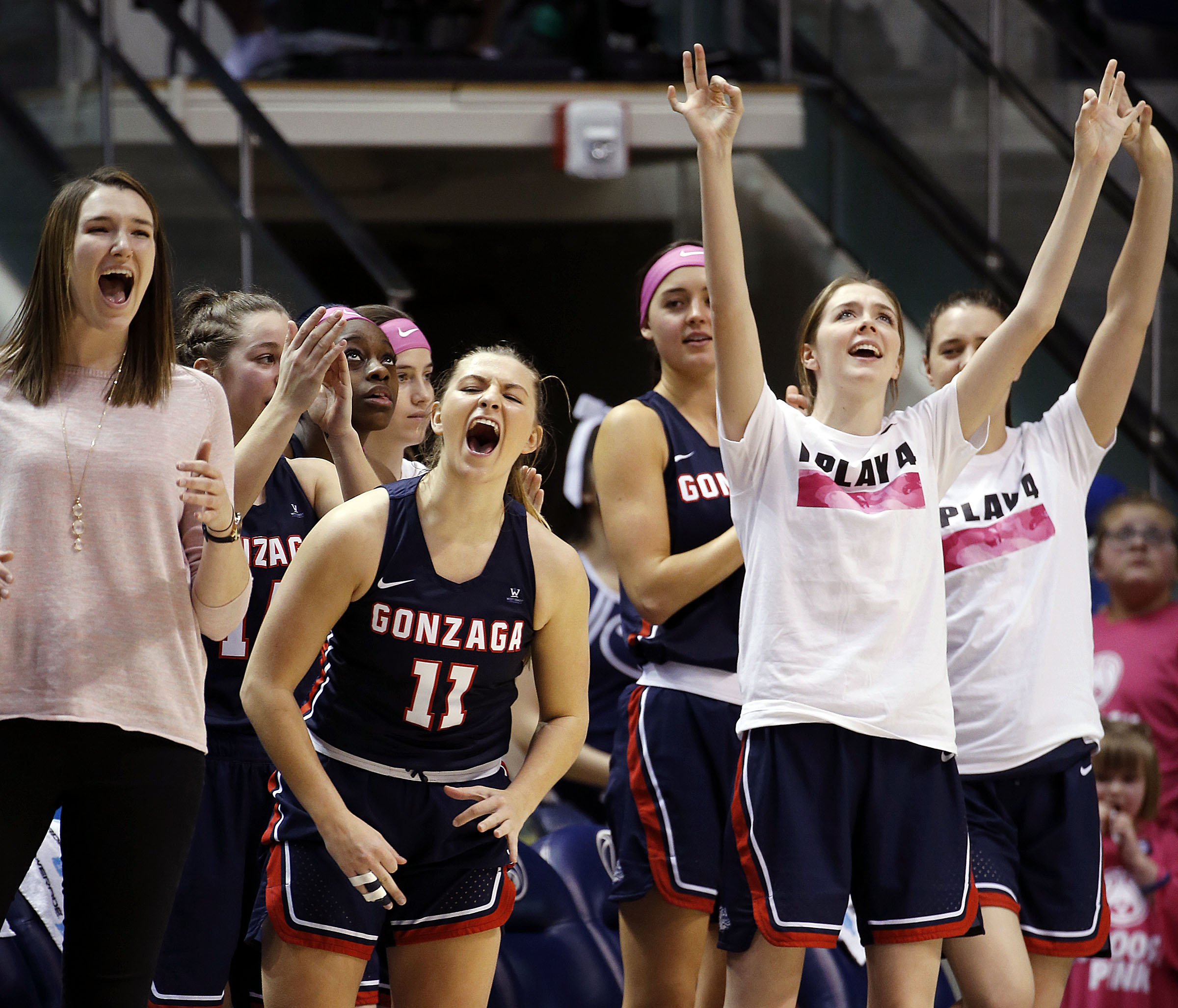 Gonzaga Bulldogs guard Laura Stockton (11) joins teammates in celebrating during NCAA basketball against BYU in Provo on Saturday, Feb. 3, 2018. (Photo: Ravell Call, Deseret News)