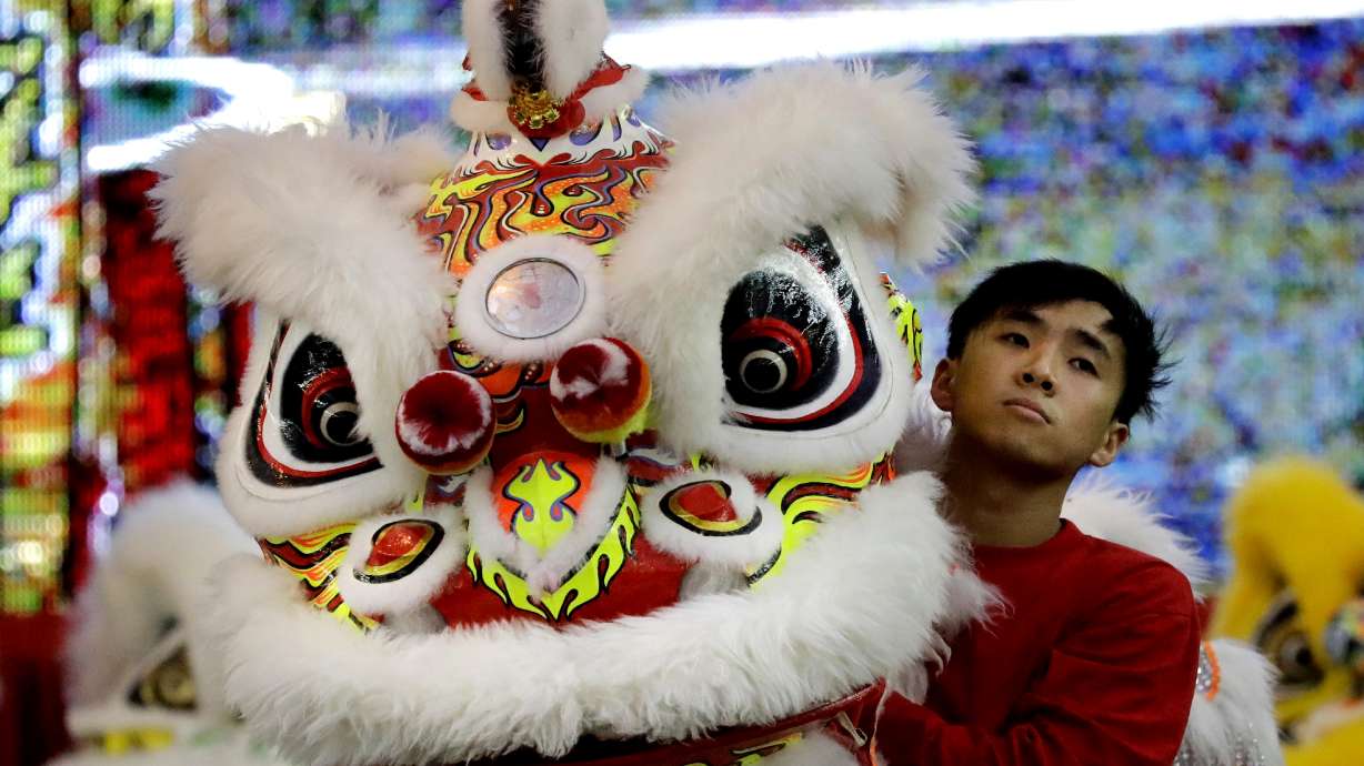 AP PHOTOS: Lion dance in Singapore ahead of Lunar New Year