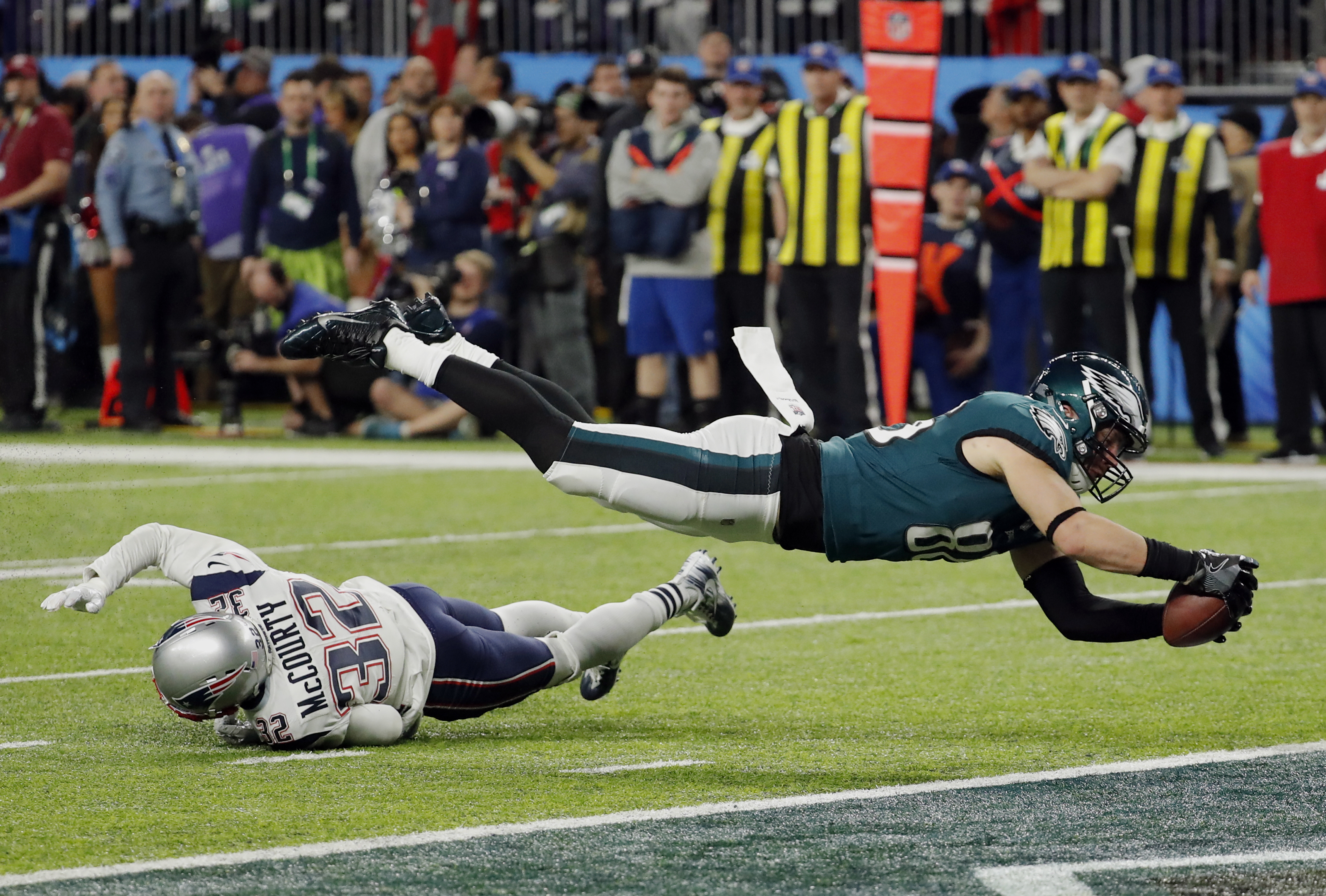 Philadelphia Eagles tight end Zach Ertz (86) dives into the end zone over New England Patriots free safety Devin McCourty (32) for a touchdown, during the second half of the NFL Super Bowl 52 football game against the New England Patriots, Sunday, Feb. 4, 2018 in Minneapolis, Minn. (Frank Franklin II, AP Photo)
