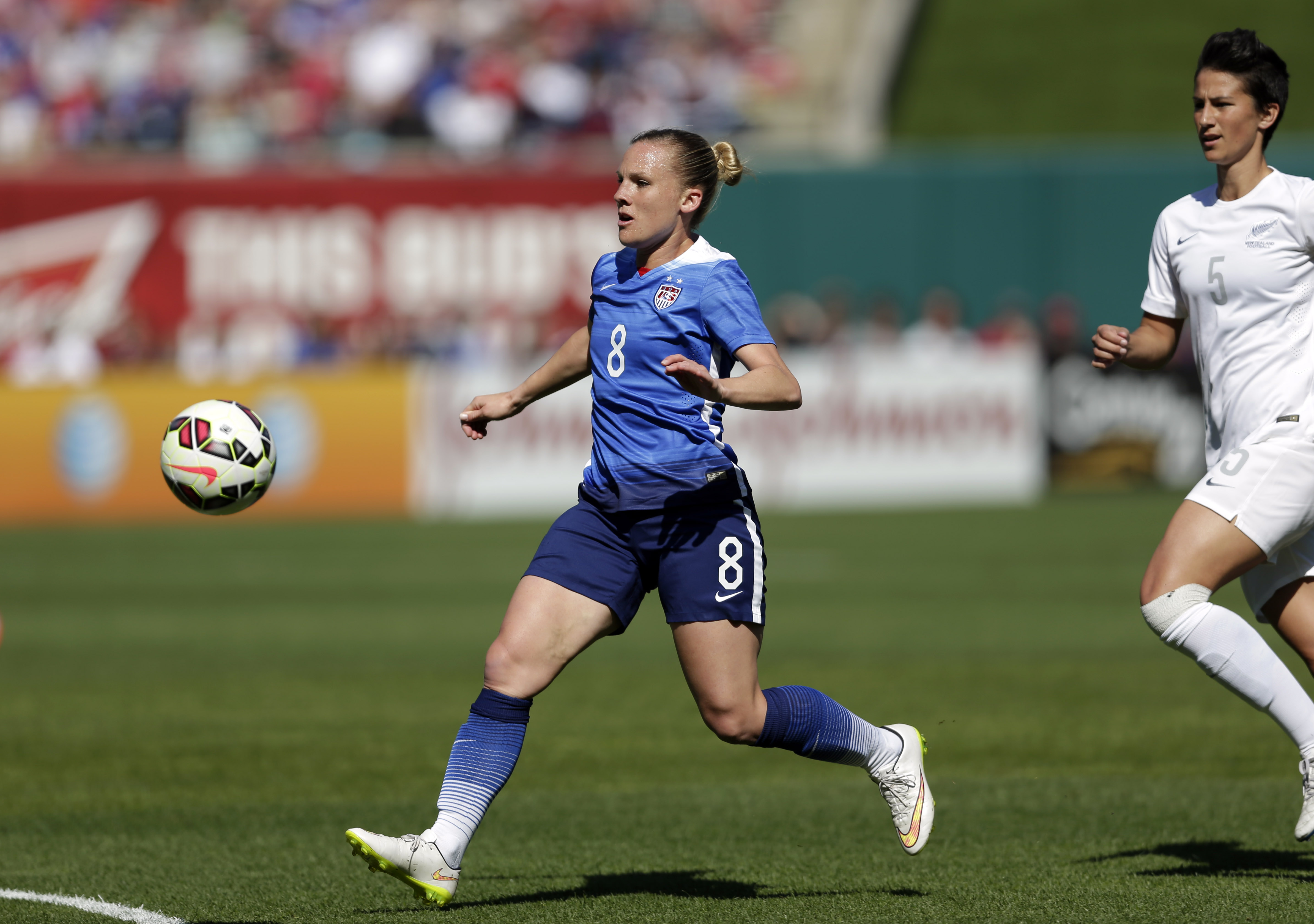 United States’ Amy Rodriguez, left, chases after a loose ball as New Zealand’s Abby Erceg watches during the first half of an exhibition soccer match Saturday, April 4, 2015, in St. Louis. (AP Photo/Jeff Roberson)