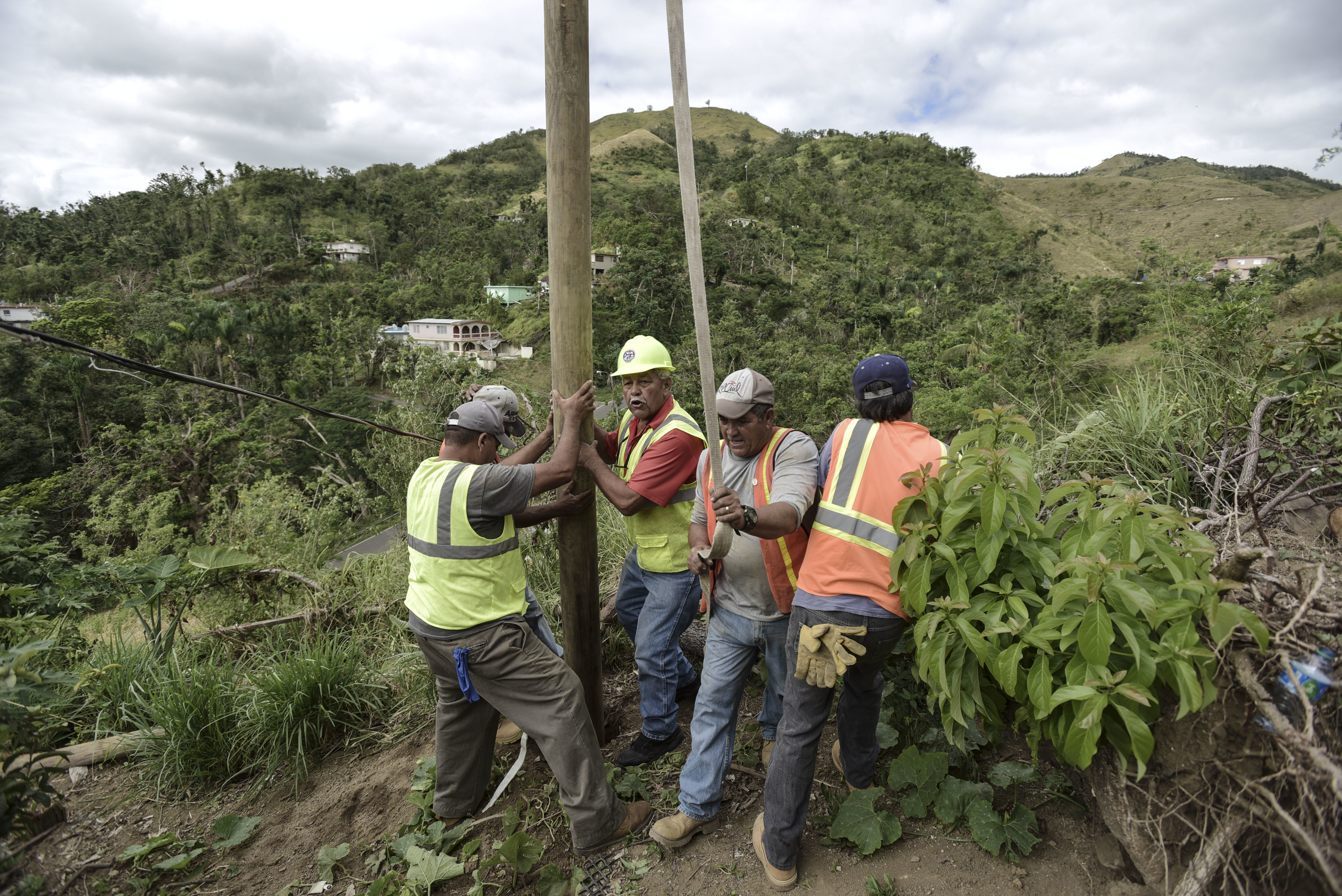 Puerto Ricans grab machetes, shovels to help restore power