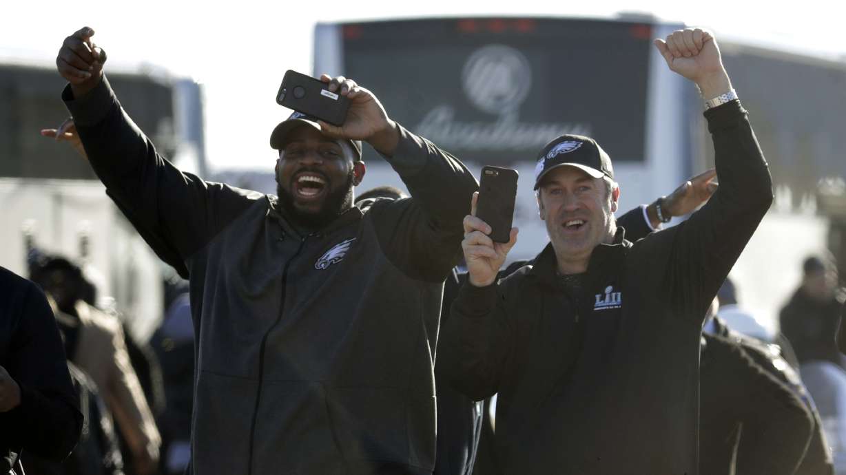 The Latest: Man charged with assaulting AP photographer