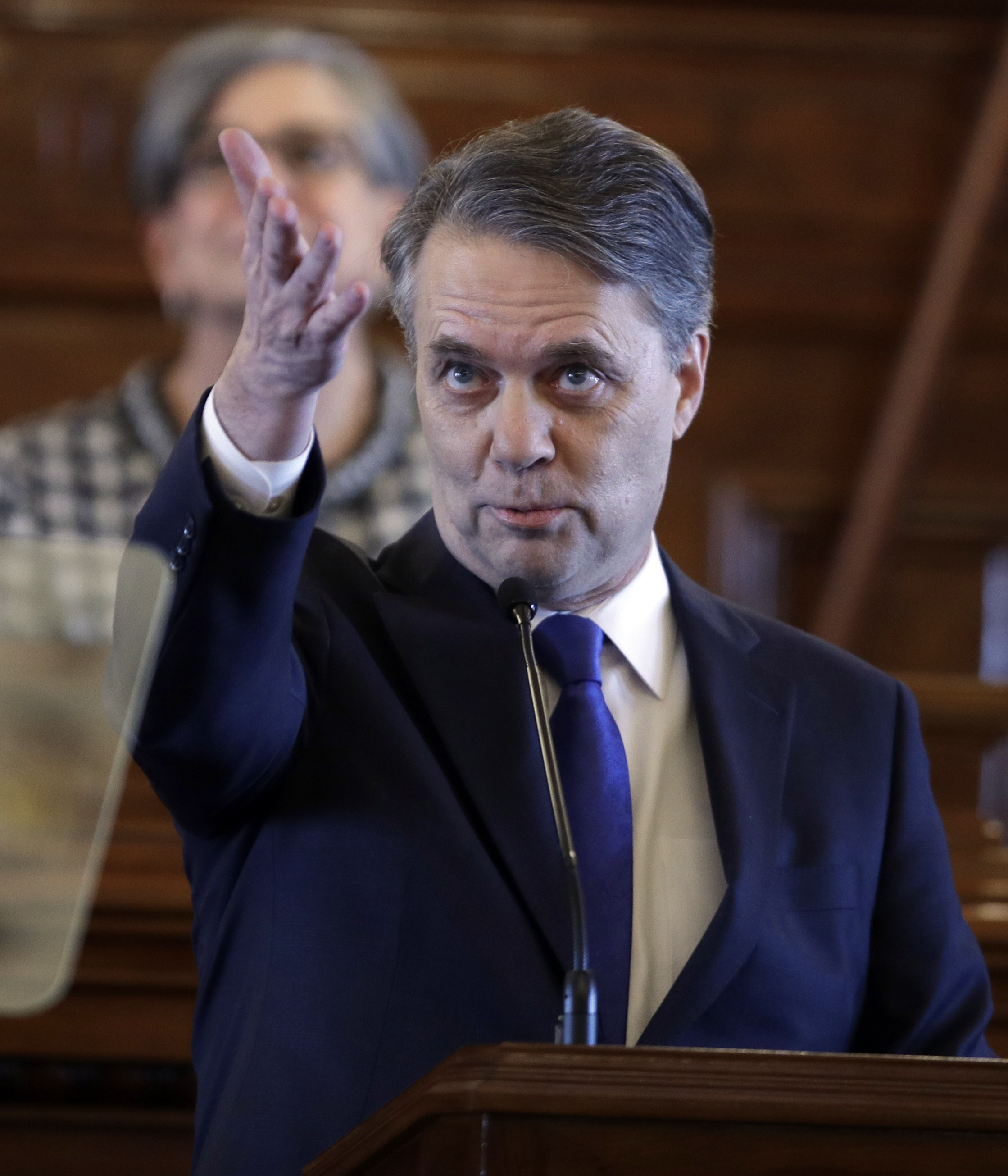 Even reaching out, Kansas governor hits hard on abortion