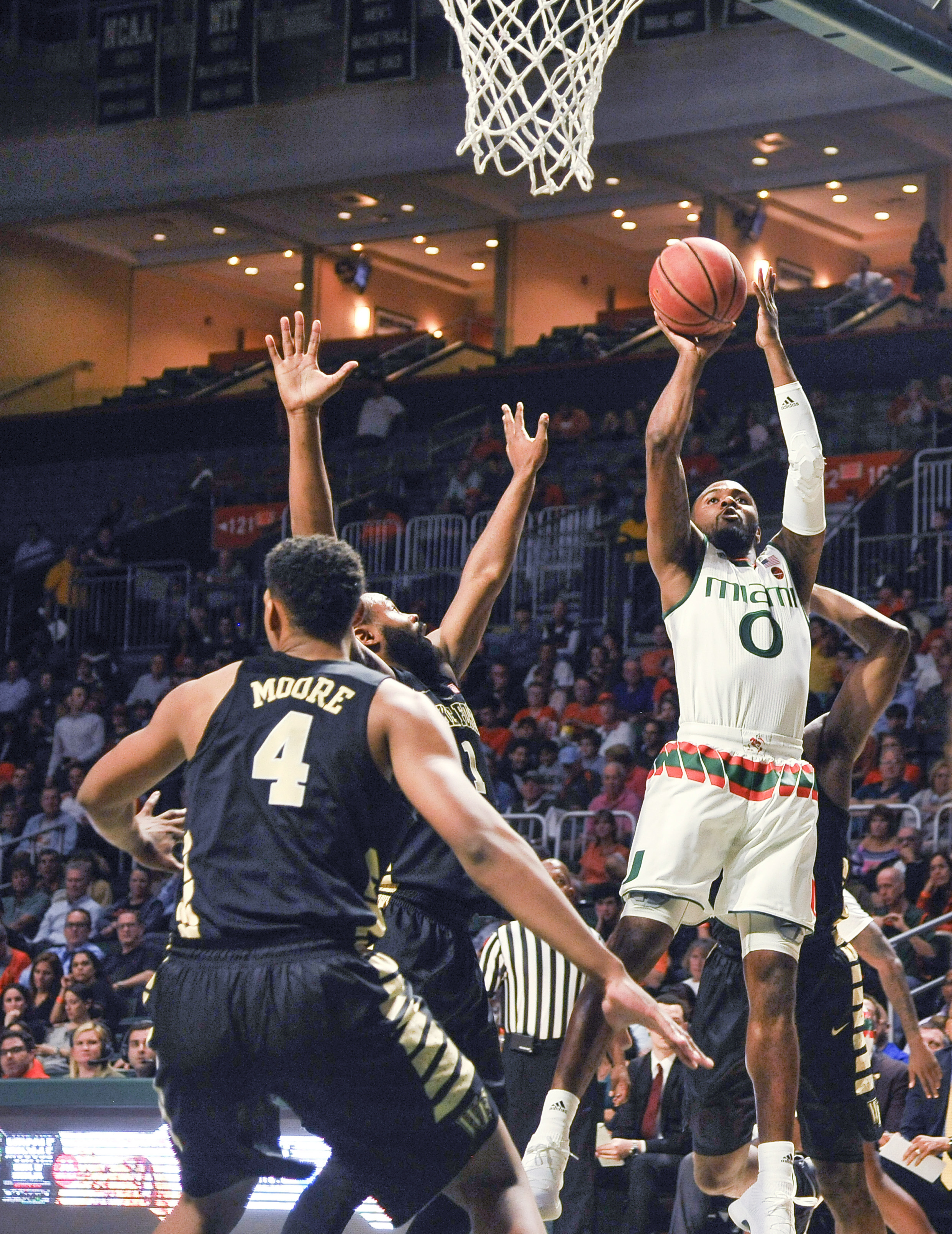Walker leads No. 25 Miami to 87-81 win over Wake Forest