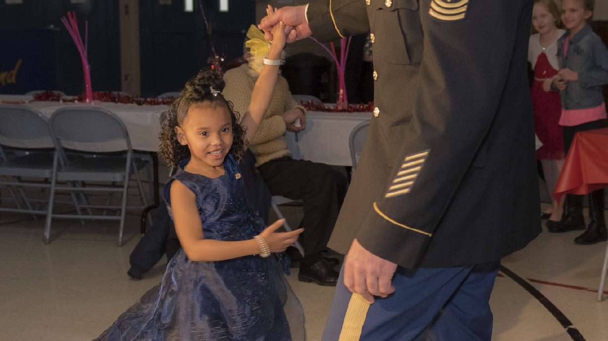 National guardsman takes girl whose dad was killed to dance