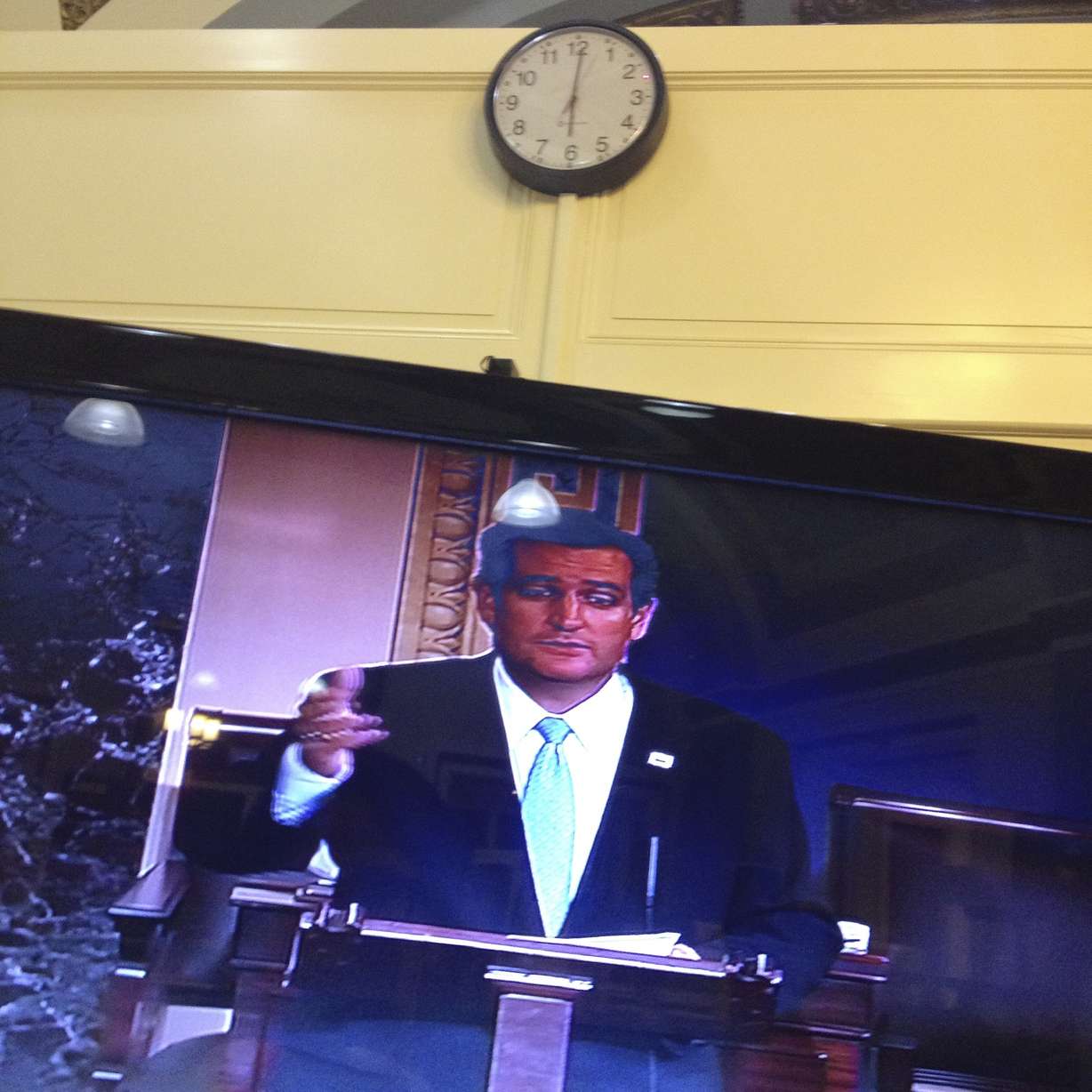 Sen. Ted Cruz, R-Texas, is seen on a television screen in the Senate Press Gallery as he speaks during the 15th hour of his filibuster on the Senate floor at the U.S. Capitol in Washington, Wednesday, Sept. 25, 2013. (Charles Dharapak, AP Photo)