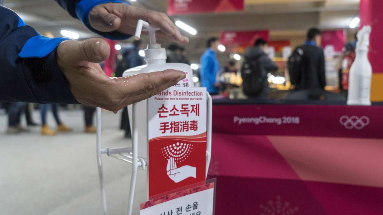 The Latest: Wellinger withstands cold to win Olympic gold