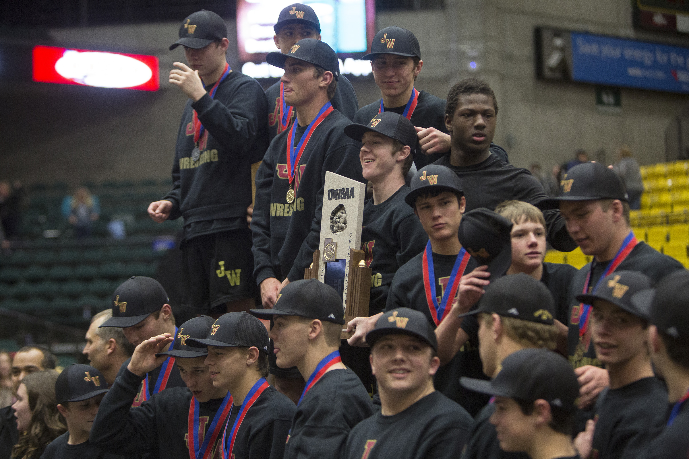 Members of the Juab wrestling team prepare to have their photo taken while being recognized as the Class 3A state wrestling champions at the Utah Valley University in Orem on Saturday, Feb. 10, 2018. (Photo: Jacob Wiegand, Deseret News)