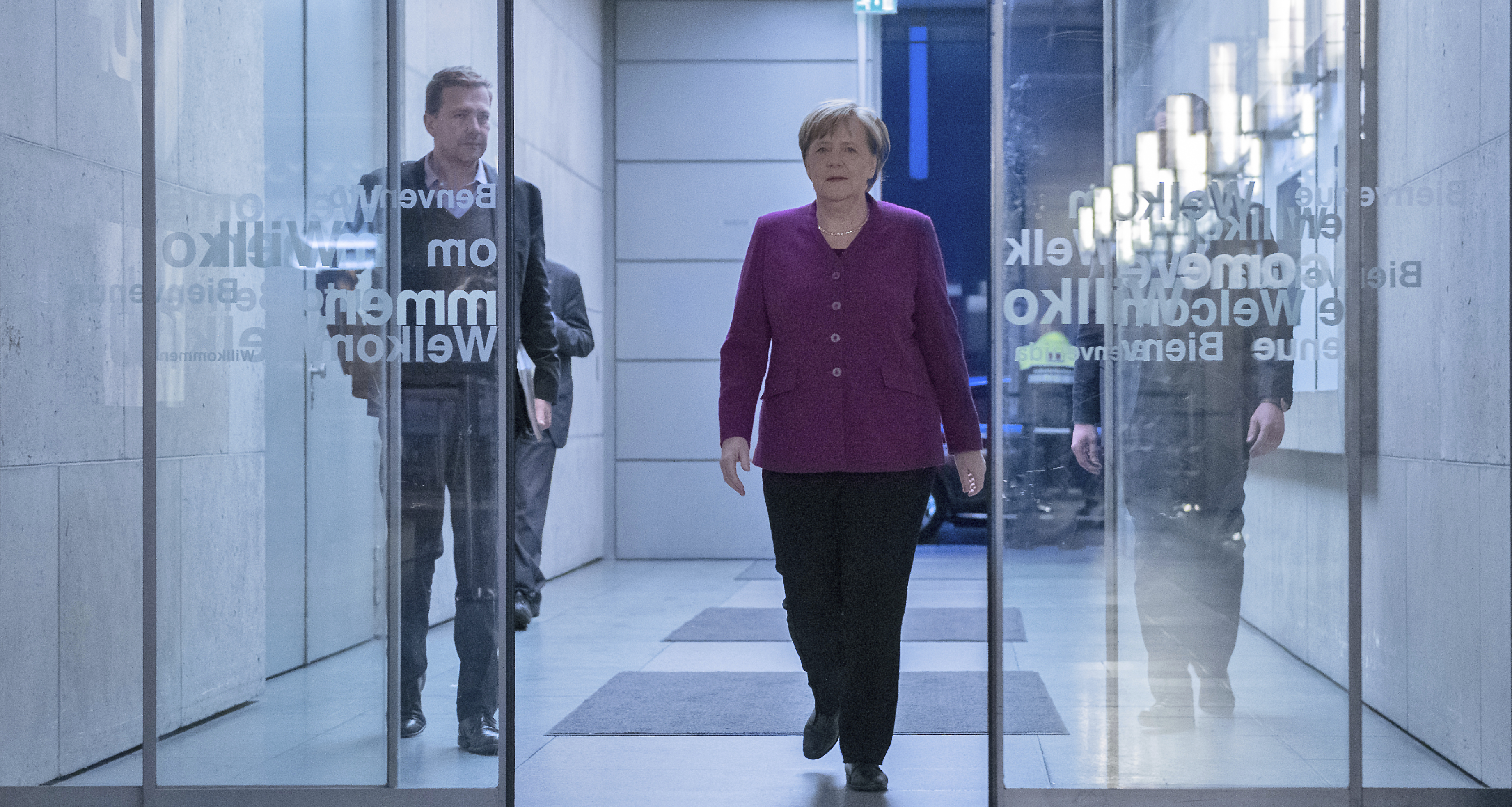 Merkel defends coalition deal against critical party members