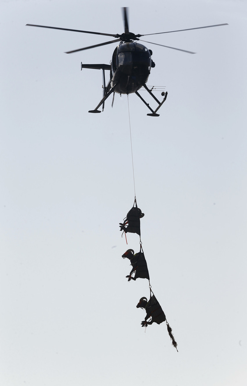 Officials with the state Division of Wildlife Resources and State Parks use a helicopter to bring about 15 sheep to a staging area at a ranch on Antelope Island, Utah, where the sheep received vaccinations and health checks Friday, Jan. 5, 2018. Bighorn sheep used to roaming rocky cliffs on an island in the Great Salt Lake found themselves in even higher altitudes Friday as they soared through the air on slings attached to helicopters. The animals' flight was part of a periodic roundup to control the sheep's population on the 15-mile (24-kilometer) long island. (Photo: Rick Bowmer, Associated Press)