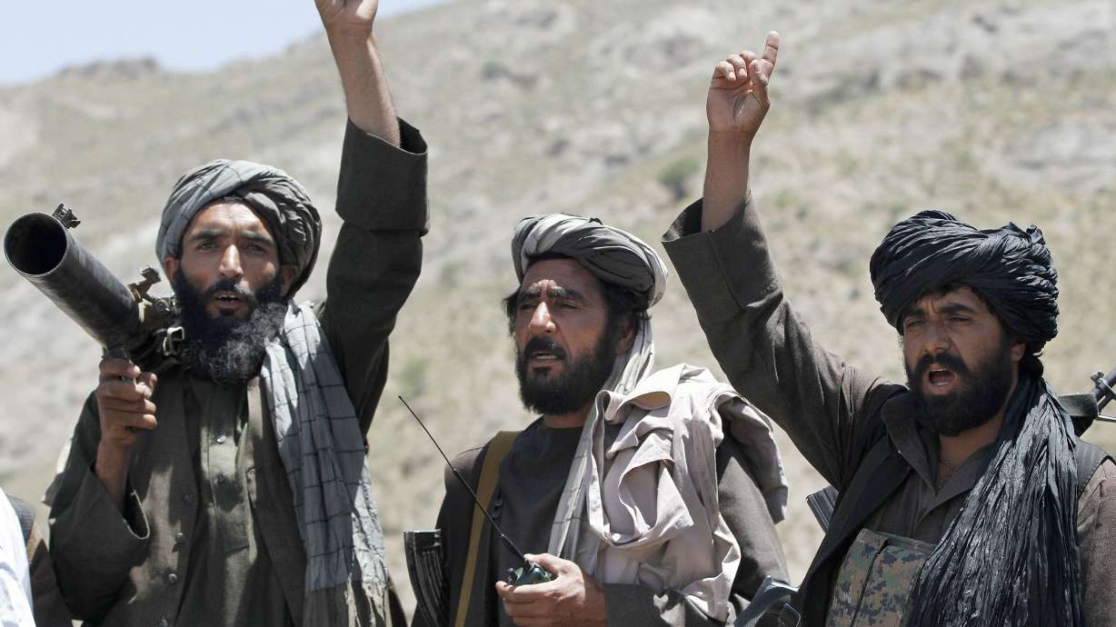 Afghan officials and Taliban talk despite wave of violence