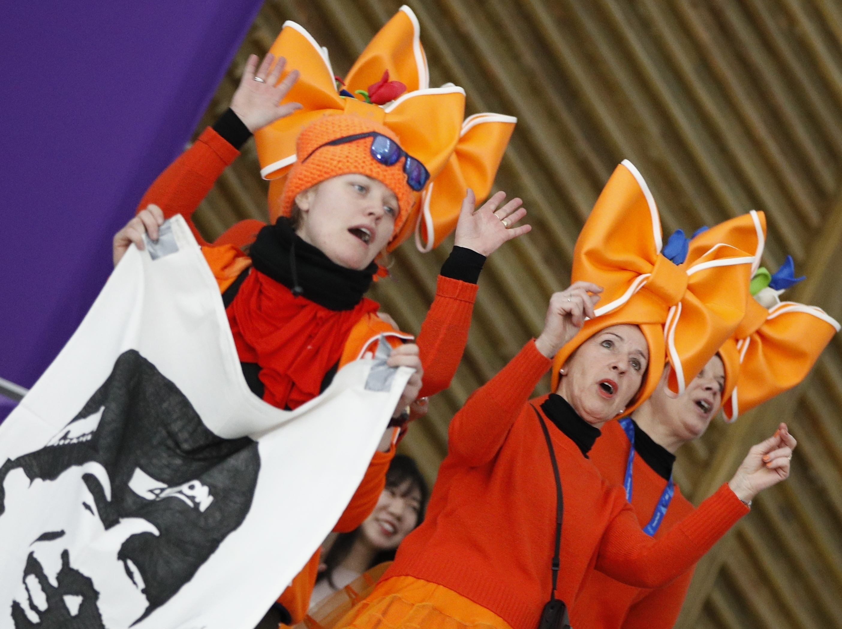 AP PHOTOS: Fans wear their national spirit on their faces